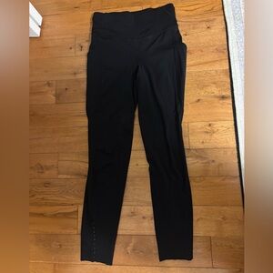 Black Lululemon leggings with dot detailing.